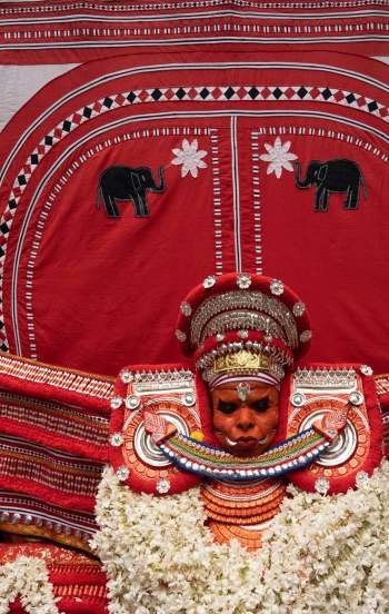 Wearing a big headgear during the performance