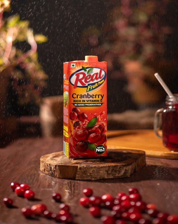 juice on the wooden piece and nuts near it