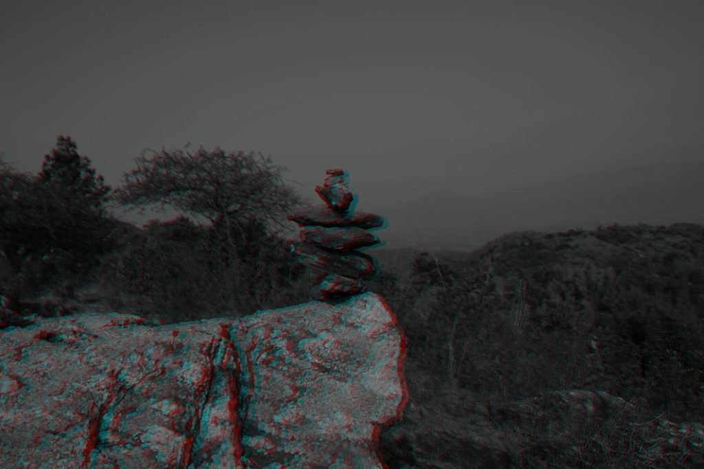 stone- balancing-the-magic-of-blue-and-red-landscape-photography-fayid-kannur