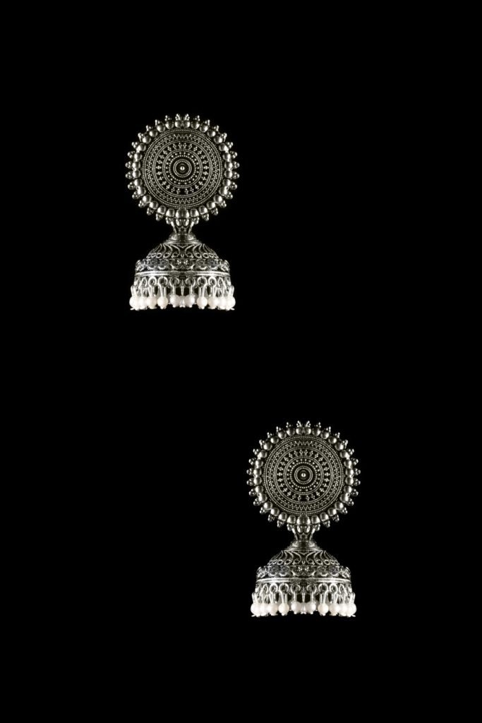 silver ring arranged in upside and downside with black background