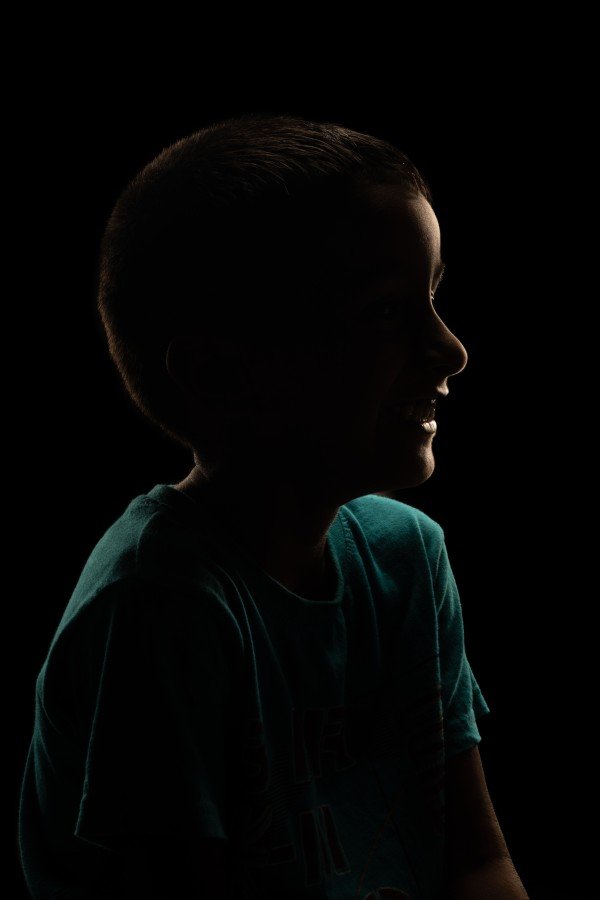 child sitting with smile