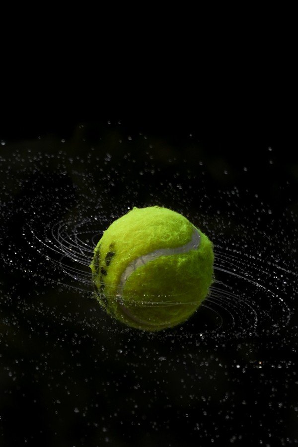 green ball in black background