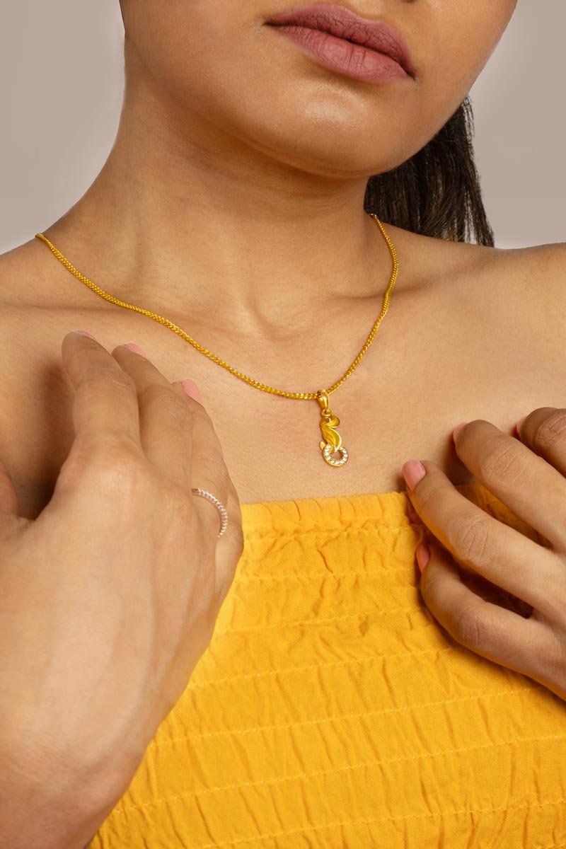 a girl showcases her necklace