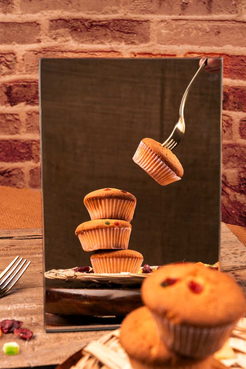 muffins with fruits seen in mirror reflection