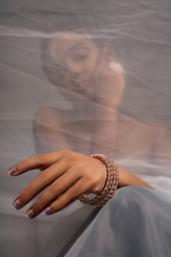 a women with gold bangle