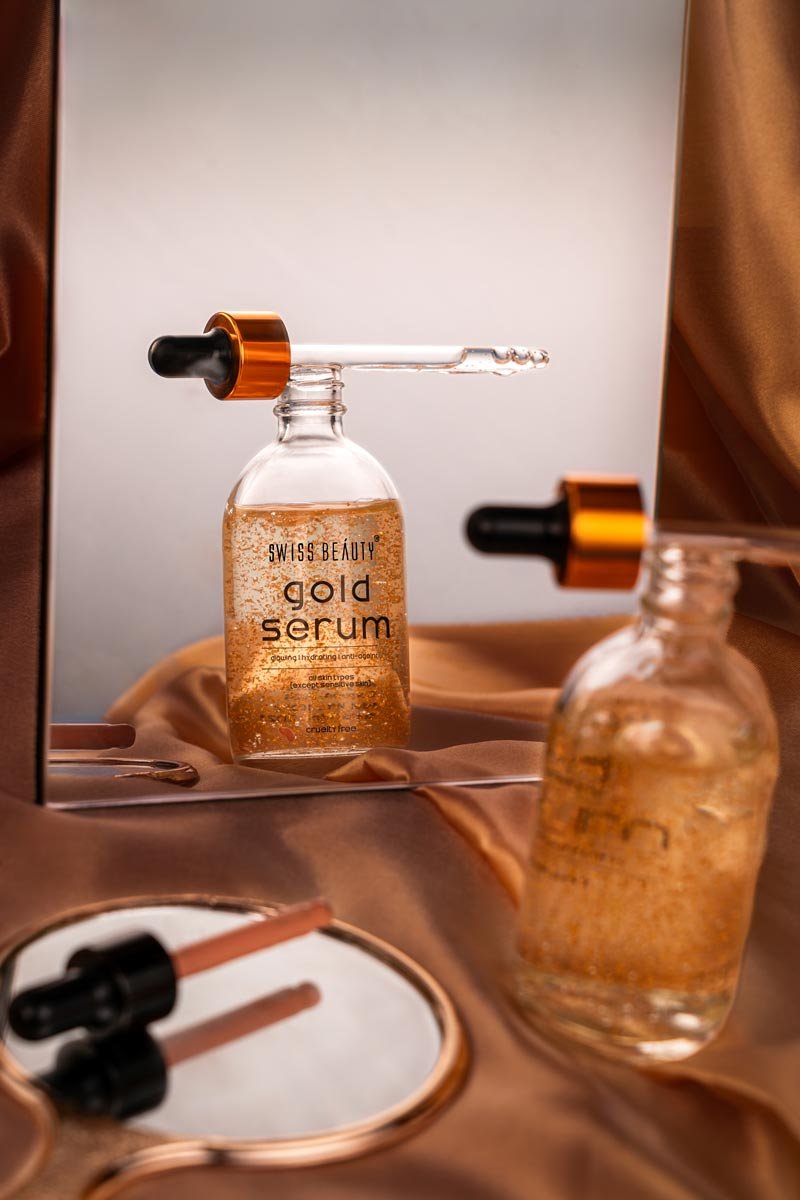 gold serum with shiny gold particles seen in mirror