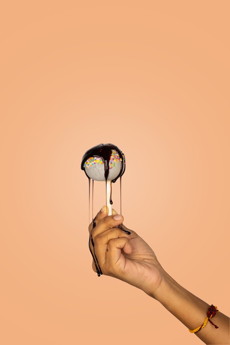 cake lollypop with chocolate syrup