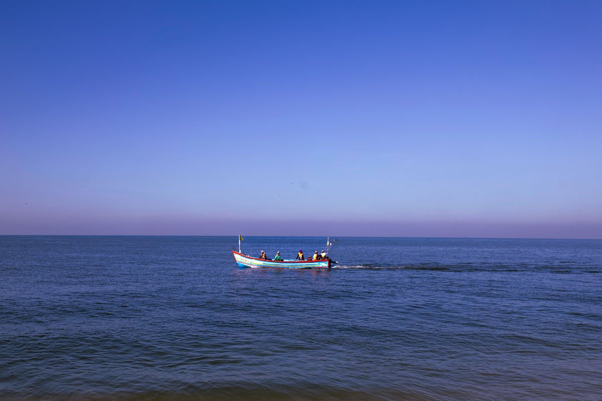 fisherman boat in blue sea
