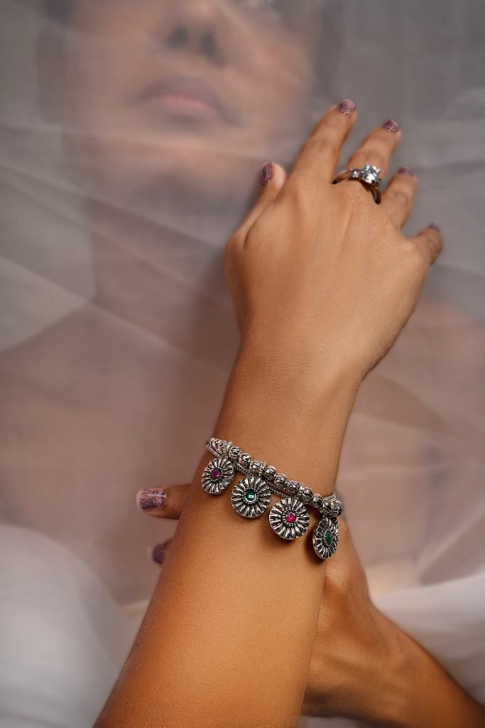 a women with silver stoned bangel