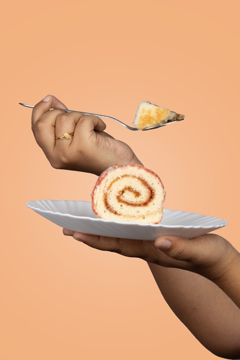 cake with spun and hand kept on plate
