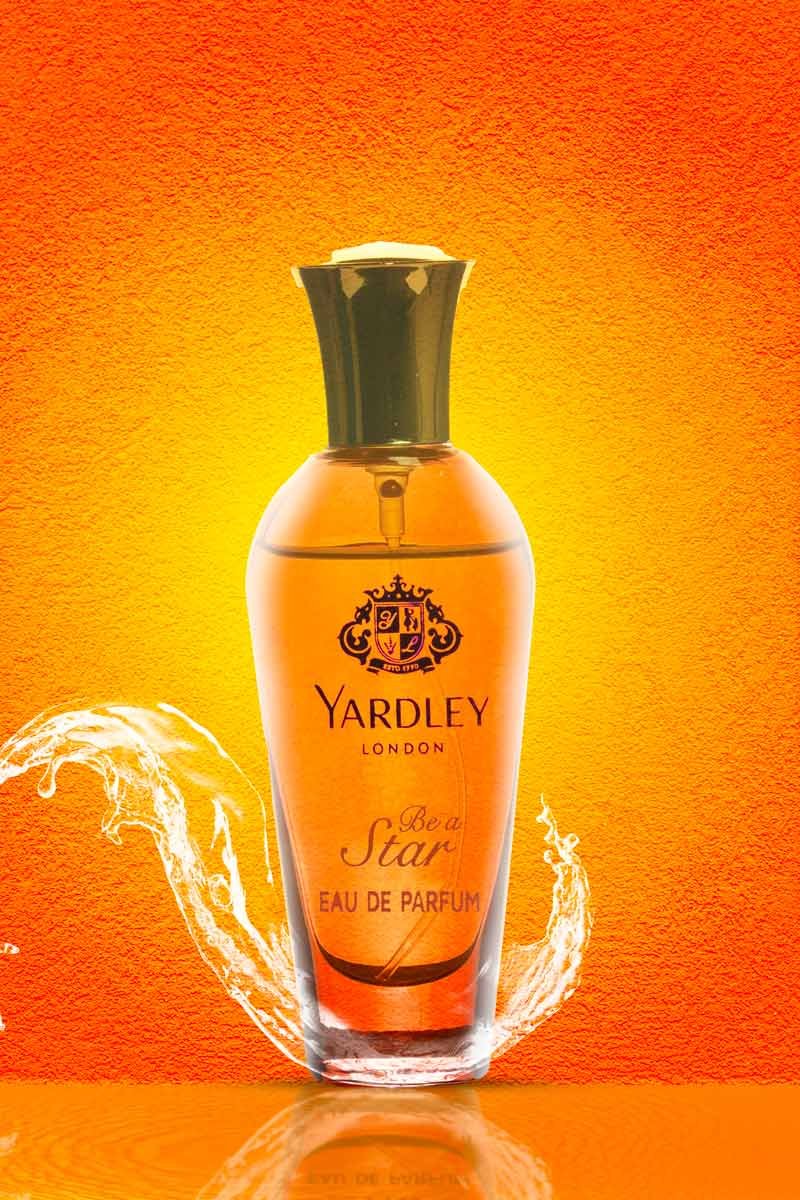 Yardley London be a star perfume with water splash in orange background