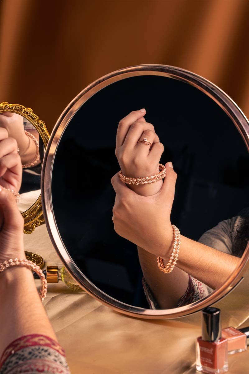 Bangles and ring seen in a mirror