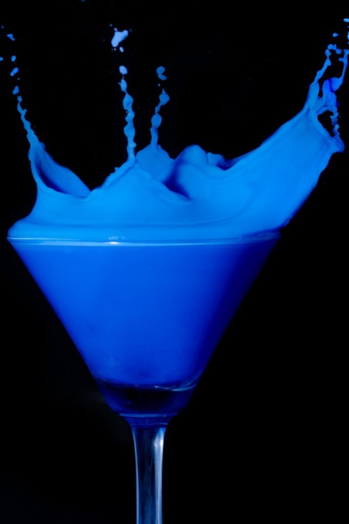 blue water in wine glass