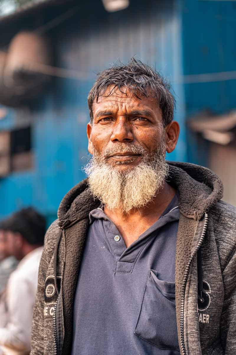 a vendor smiling in the early morning