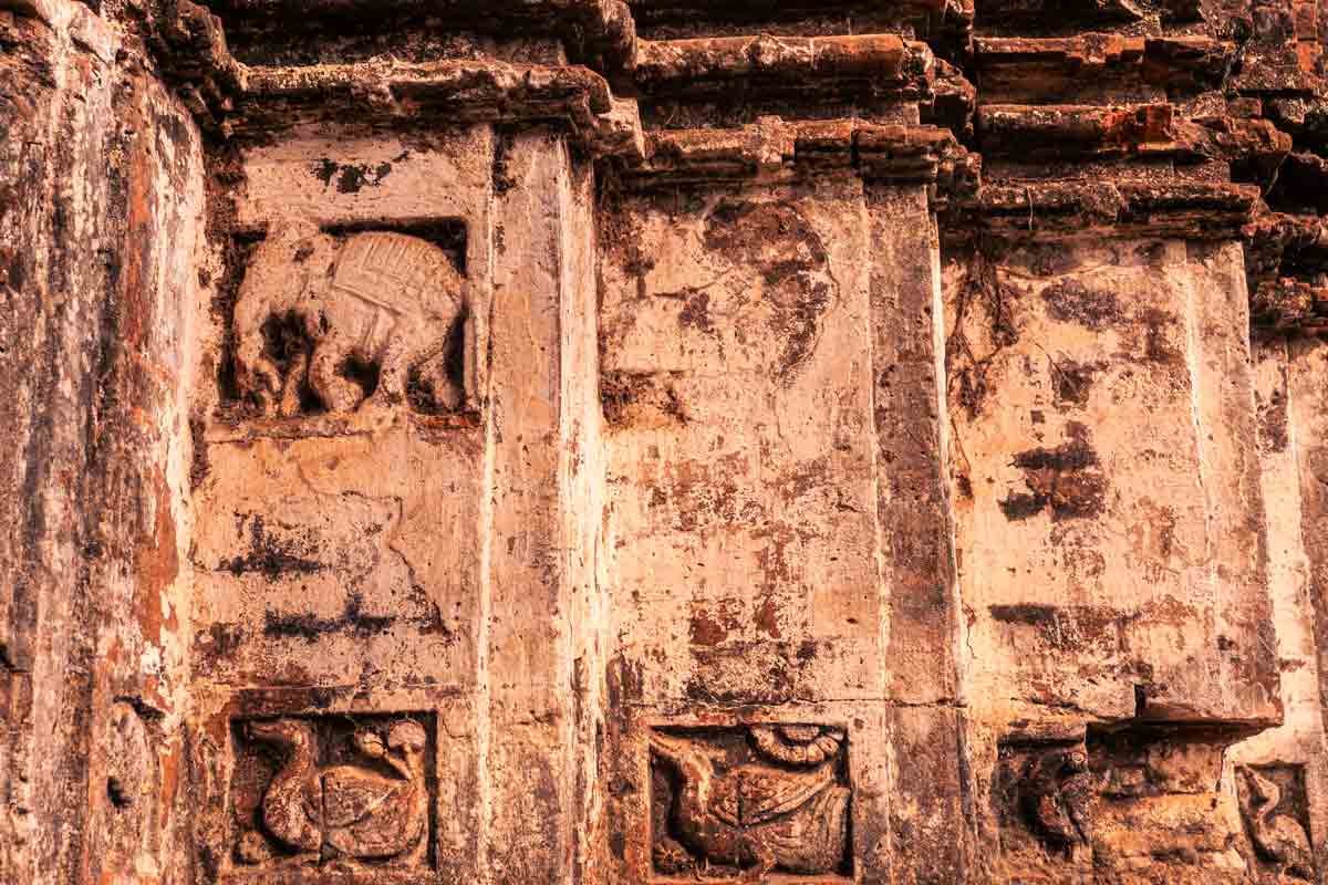 close up of carved elephants and birds