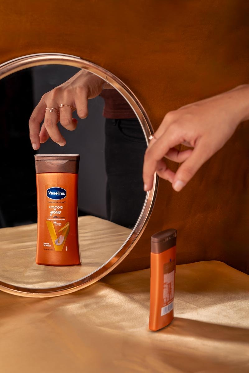 cocoa glow body lotion reflection seen in mirror
