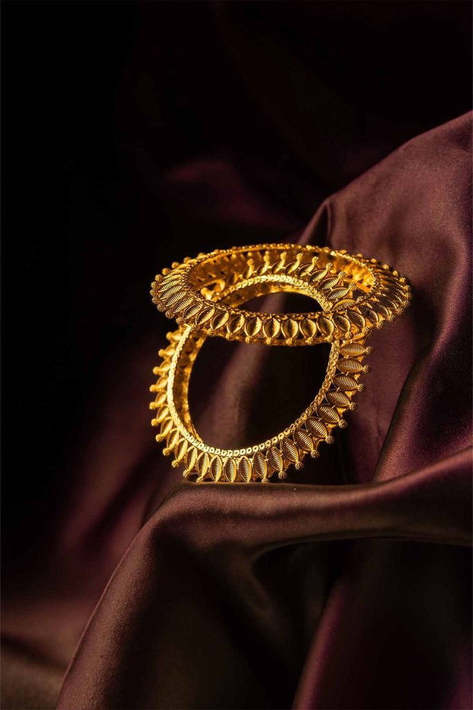 textured bangles placed above another