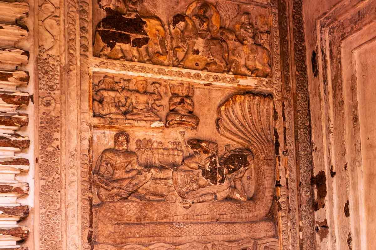 carvings of gods' stories onto wall
