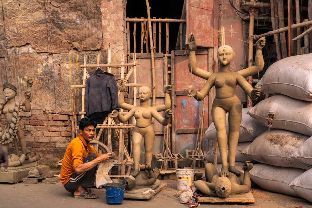 a sculptor sculpting idols