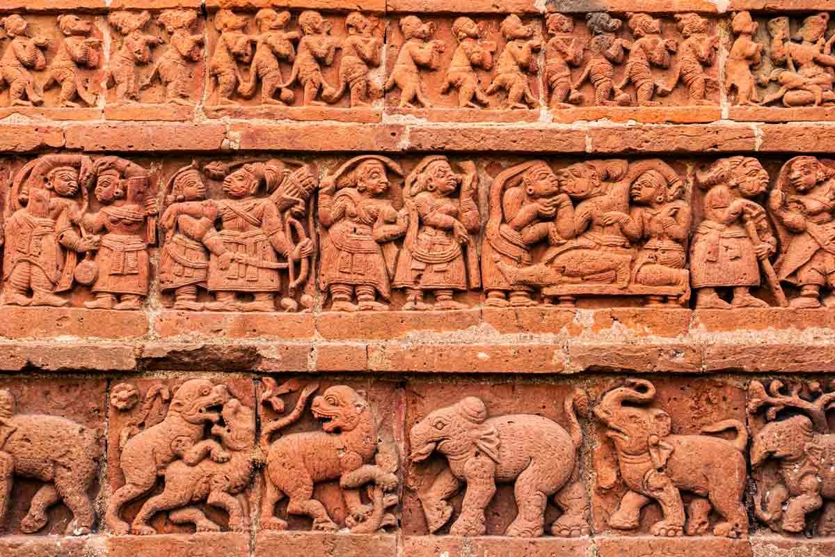 detailed carvings of humans and animals