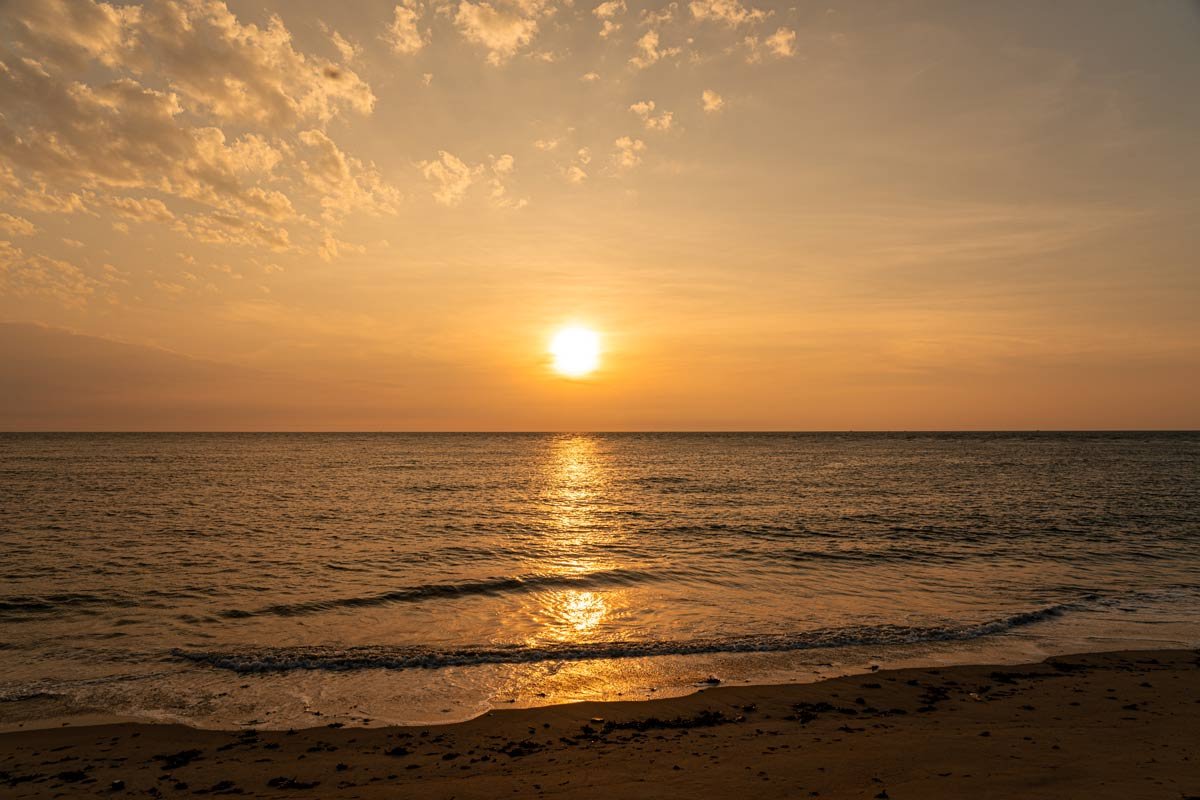 a sunset in seashore