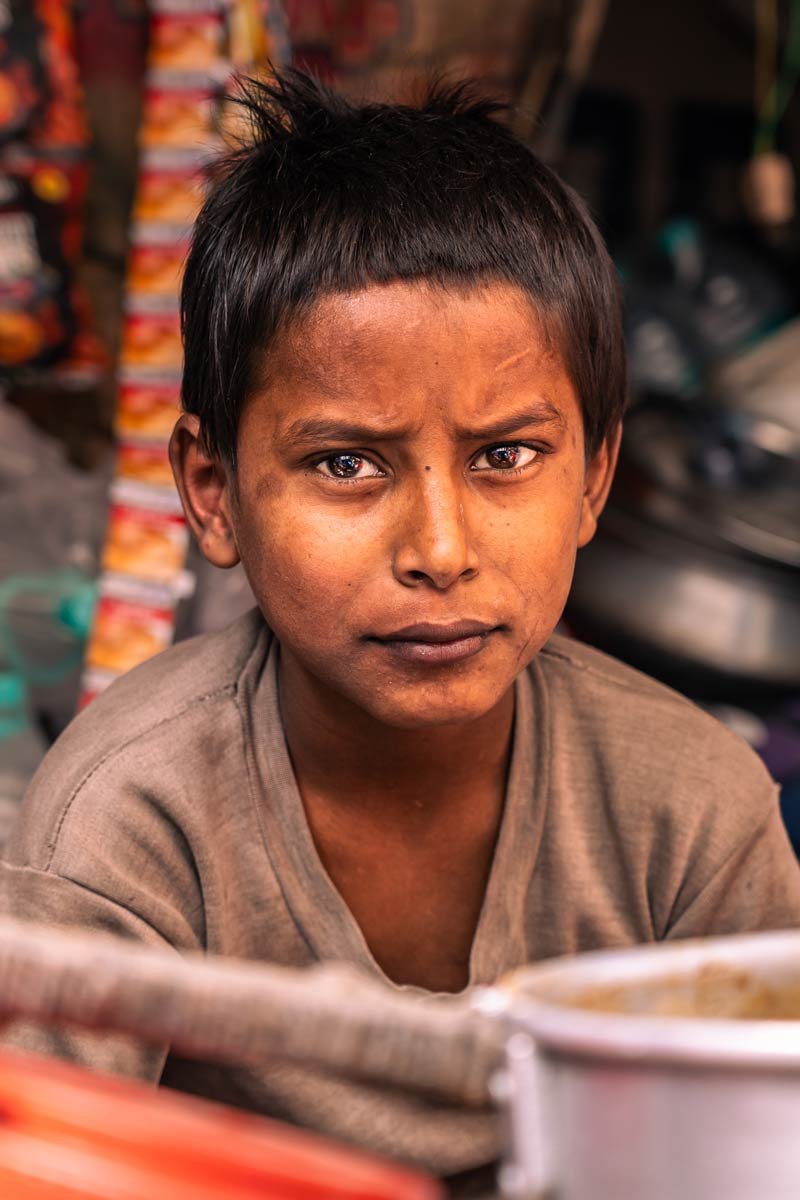 a small boy in a tea shop