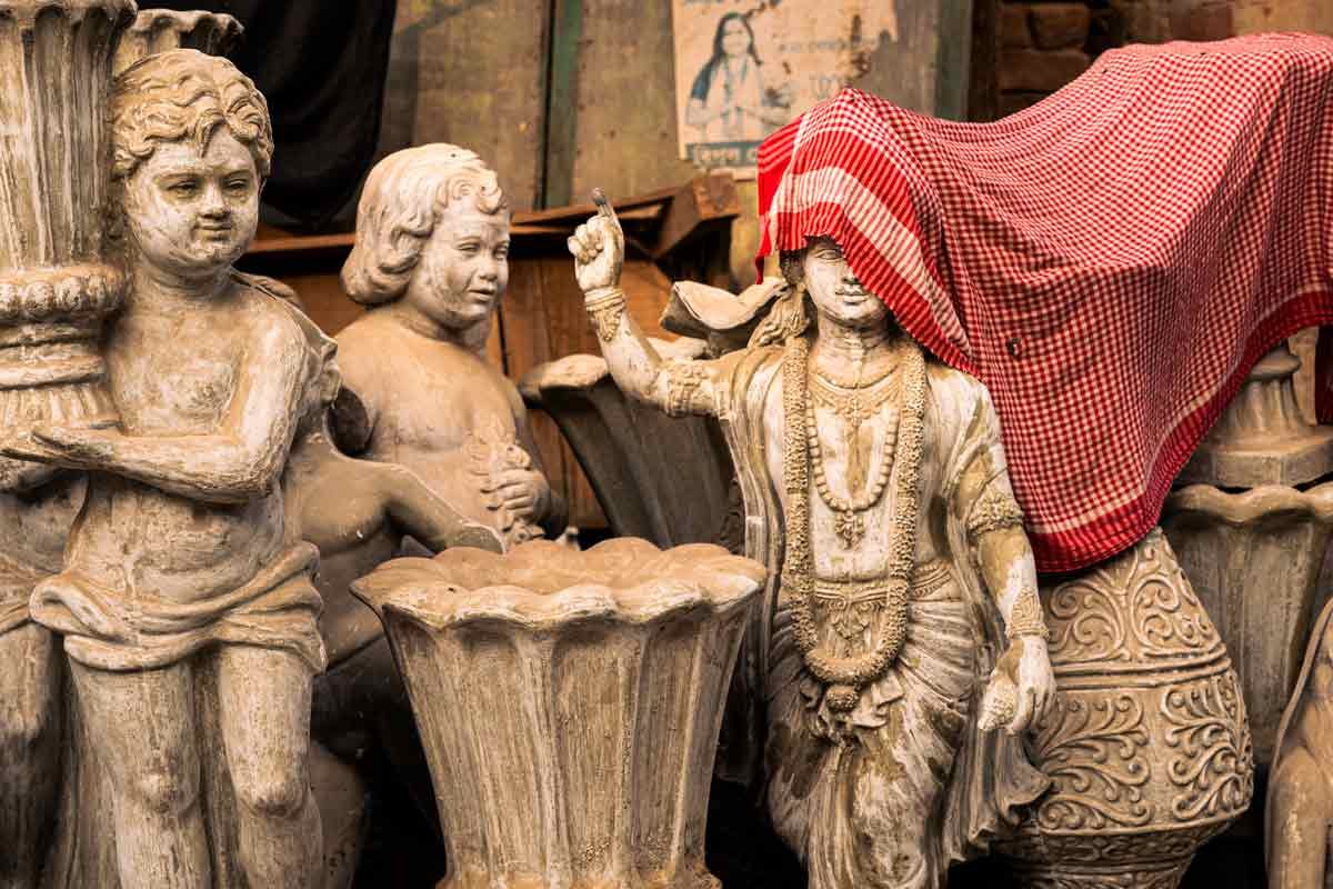 sculpture partially covered with cloth