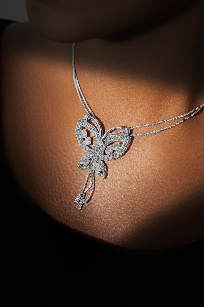 Butterfly stones shines on her neck