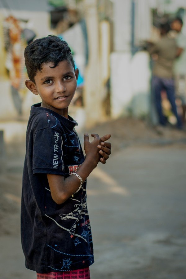one boy stand by turning to one side