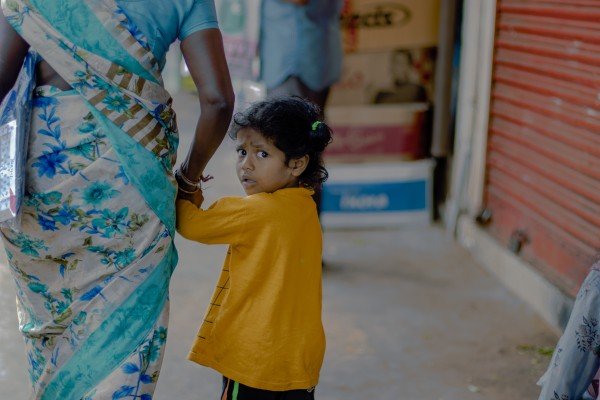 an aunt holding a small child