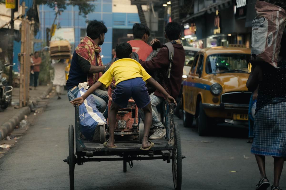 Joyful ride of a kid on the rikshaw