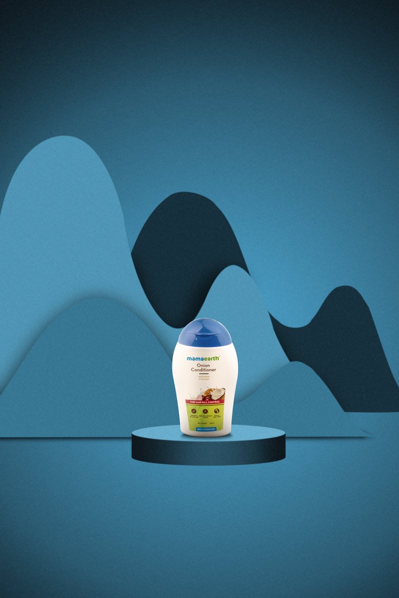 small bottle onion conditioner in a blue background