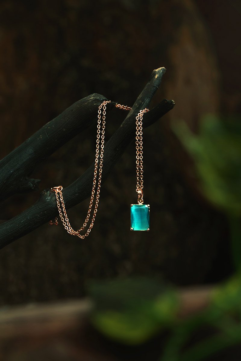 sapphiregleam jwellery hanging on a small tree branch