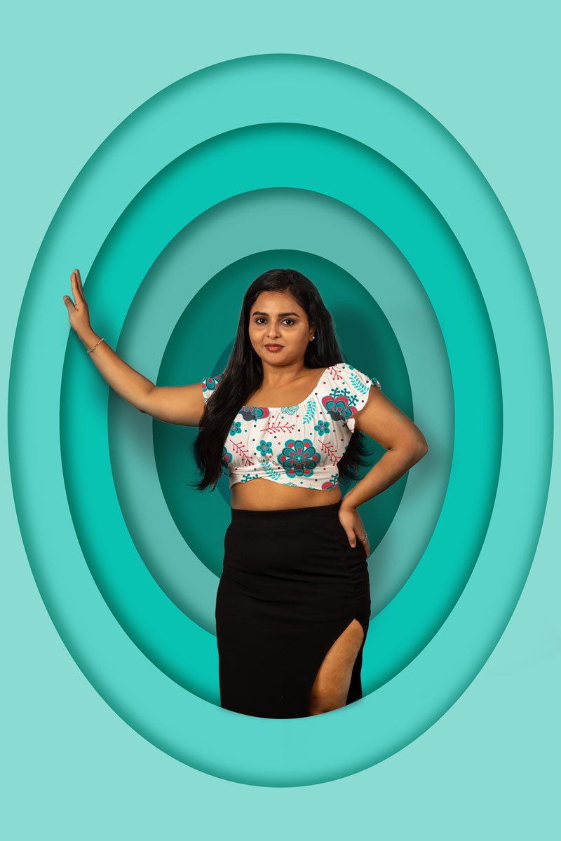 Model standing inside graphic oval