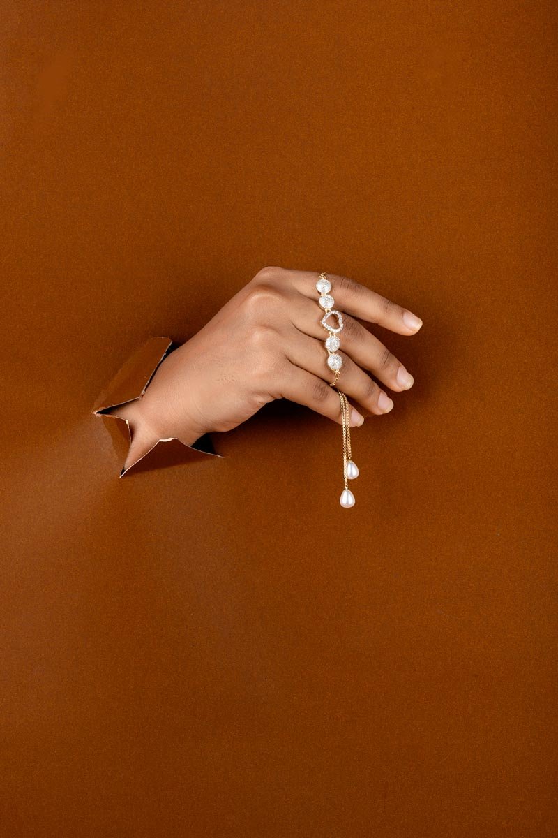 Showing the beauty of jewelry design through hands.
