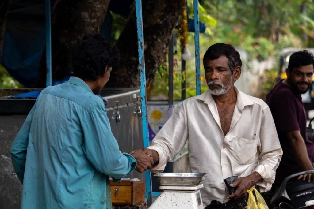 Customer purchasing fish from seller.