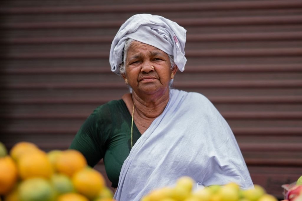 An old woman selling fruits