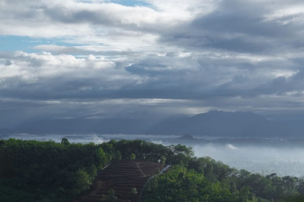 Green hills under sky