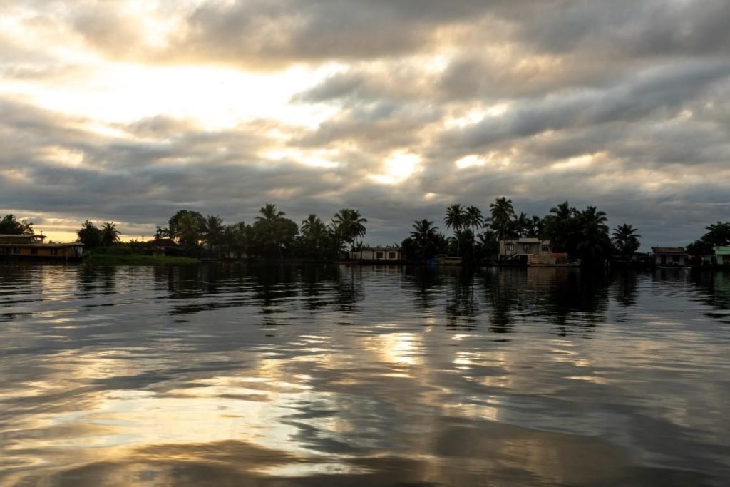 Calm backwater with sky reflection.