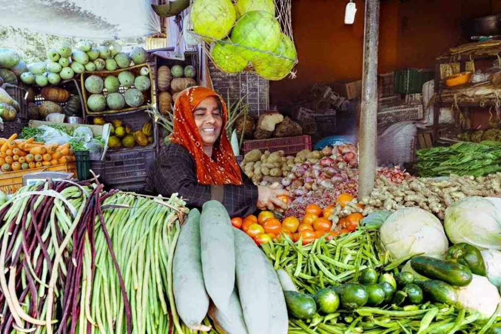 woman selling vegetables in market