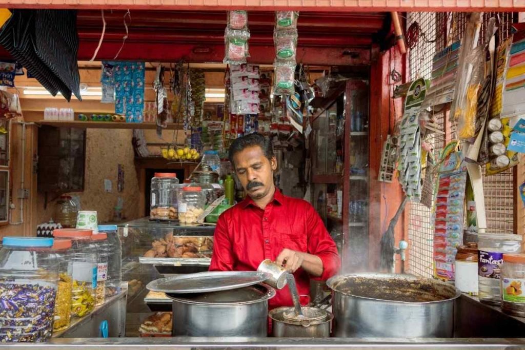 tea stall owner brewing tea