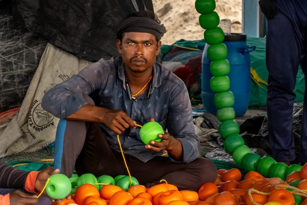 A worker gazing into camera while working.