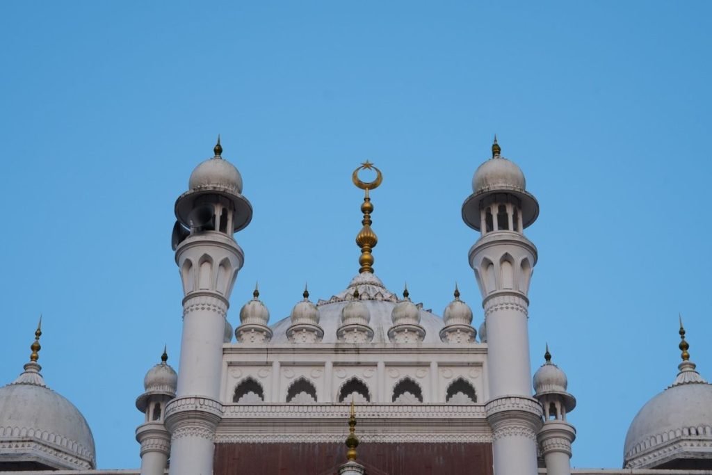 a masjid top with half moon and star