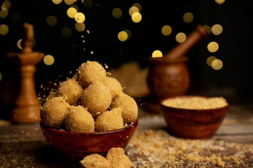 Golden laddoos on festive display.