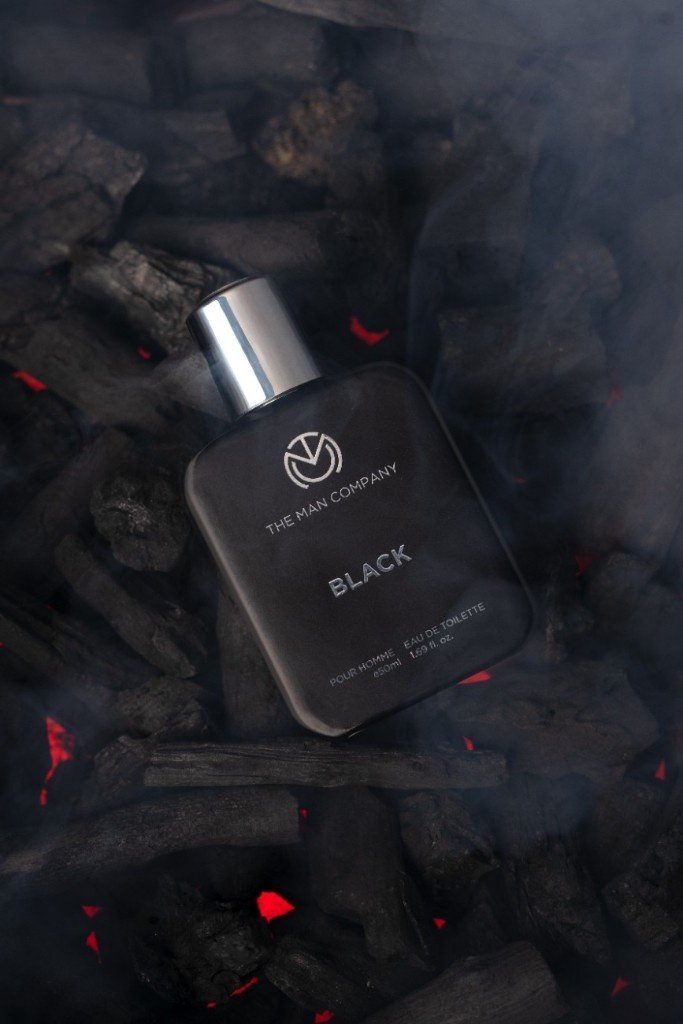 A perfume bottle on hot charcoal.