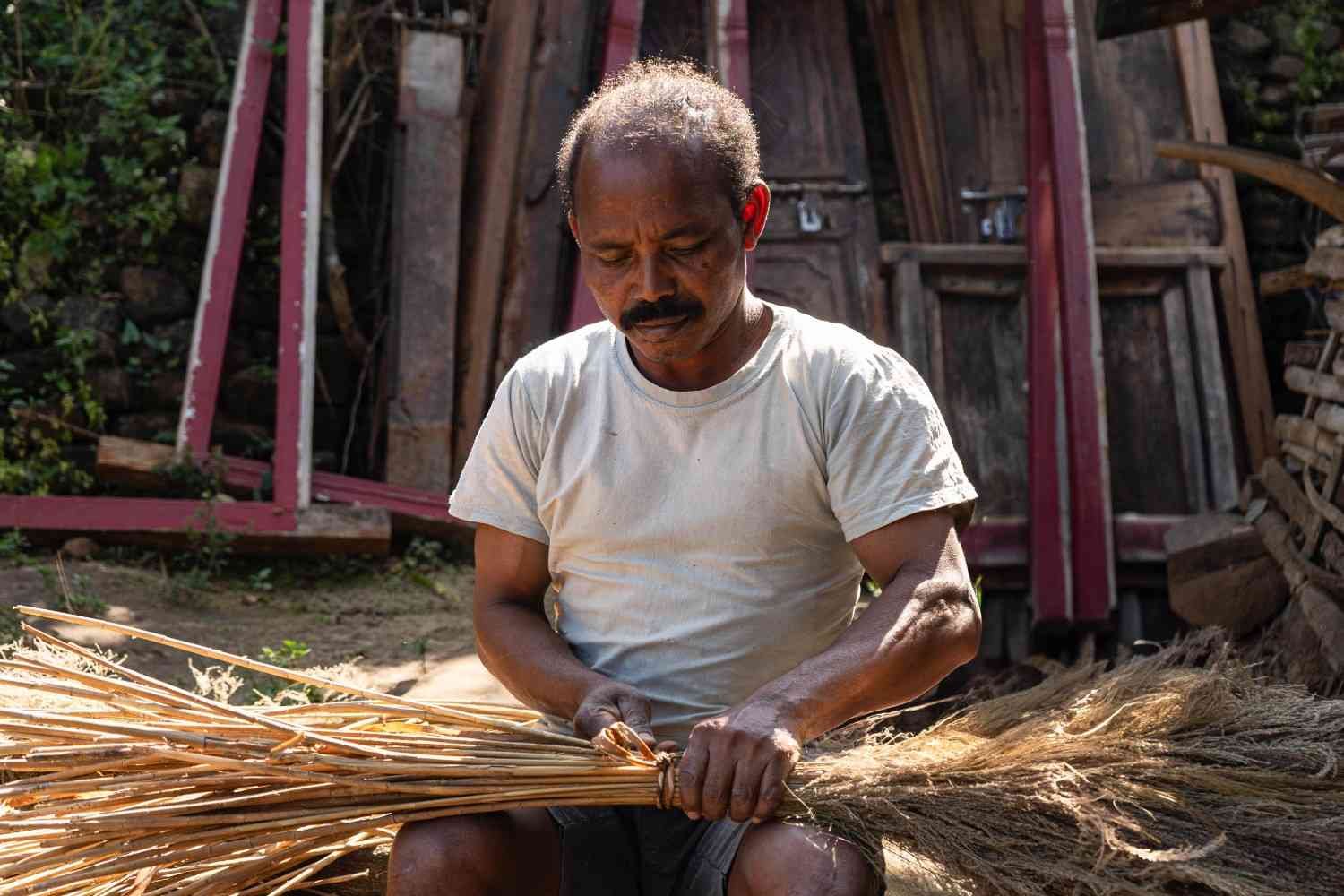 a man is preparing a broom.