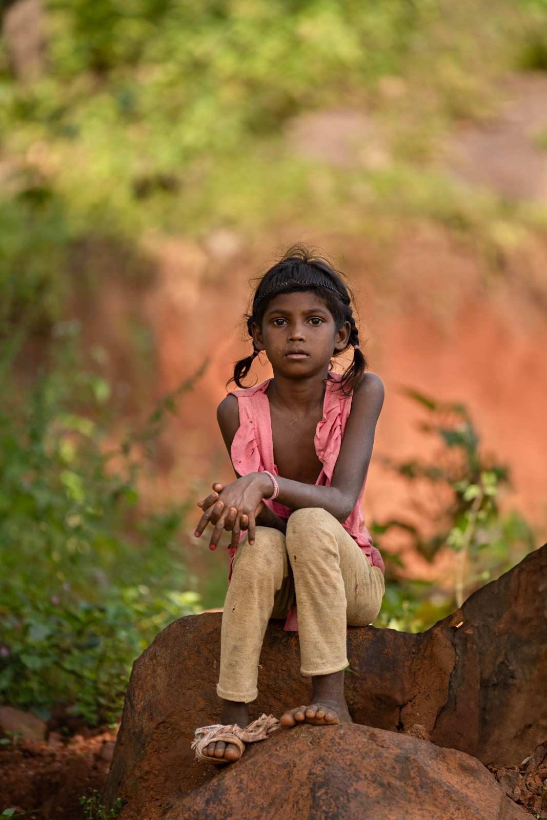a girl is looking without out any expression