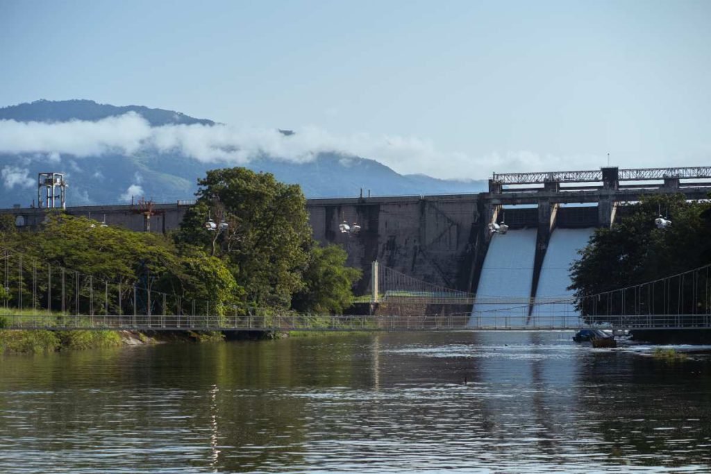 A hillside water dam receiving water from the waterfall.