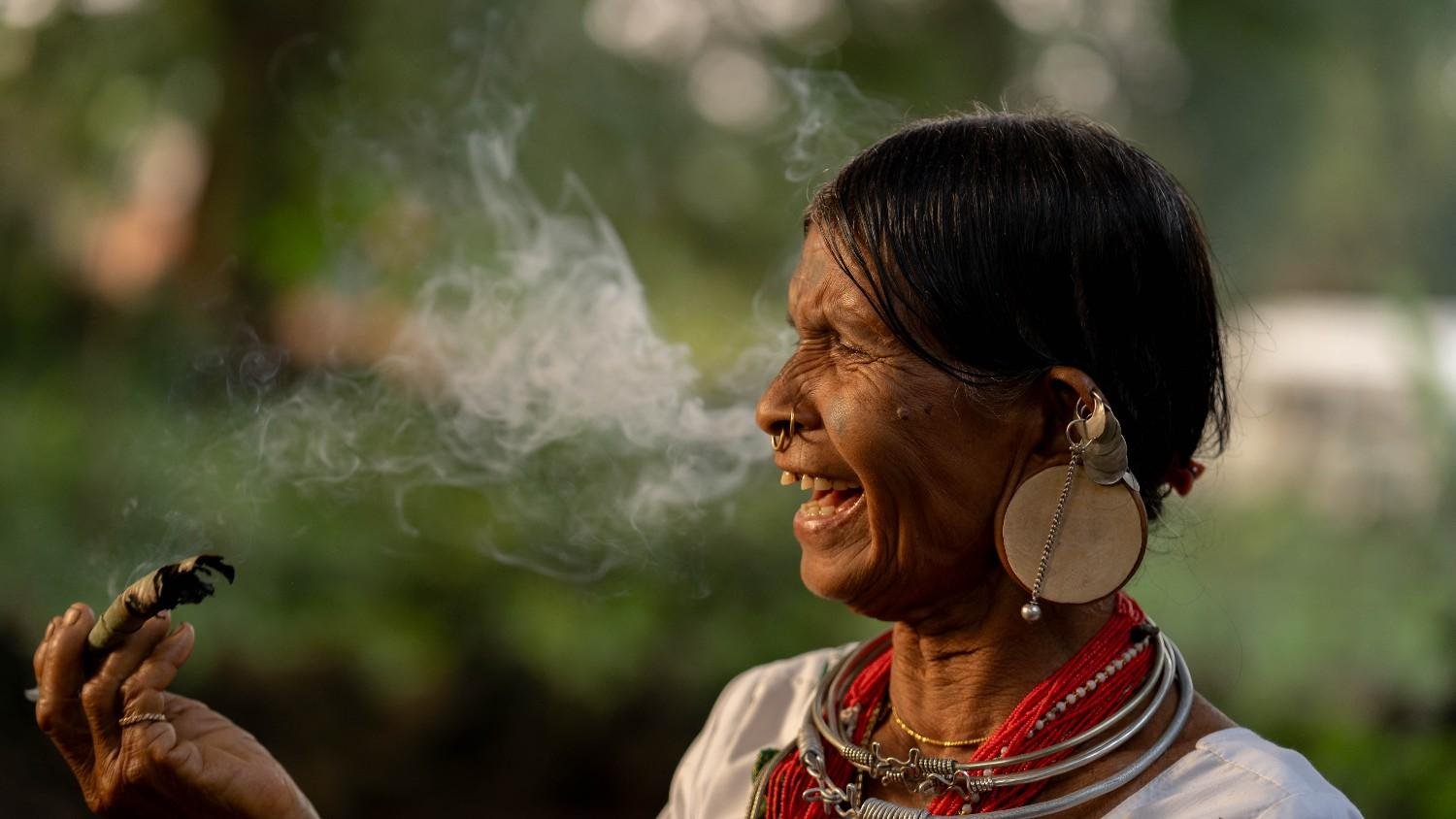 a lady is laughing after her smoke done