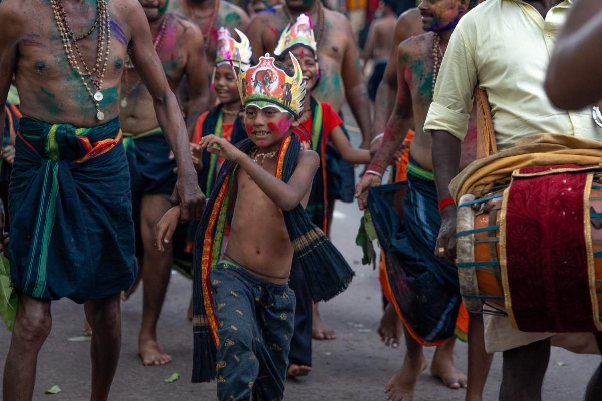 boy dancing with his father holding his hand